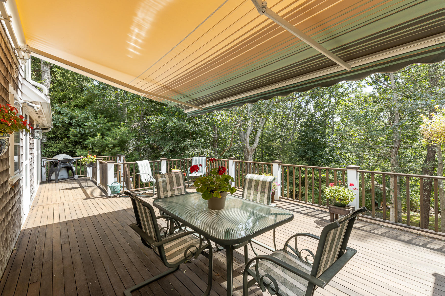 230 Santuit Road Cotuit, MA 02635 - Photo 30 of 46 a balcony with wooden floor outdoor seating and wooden floor