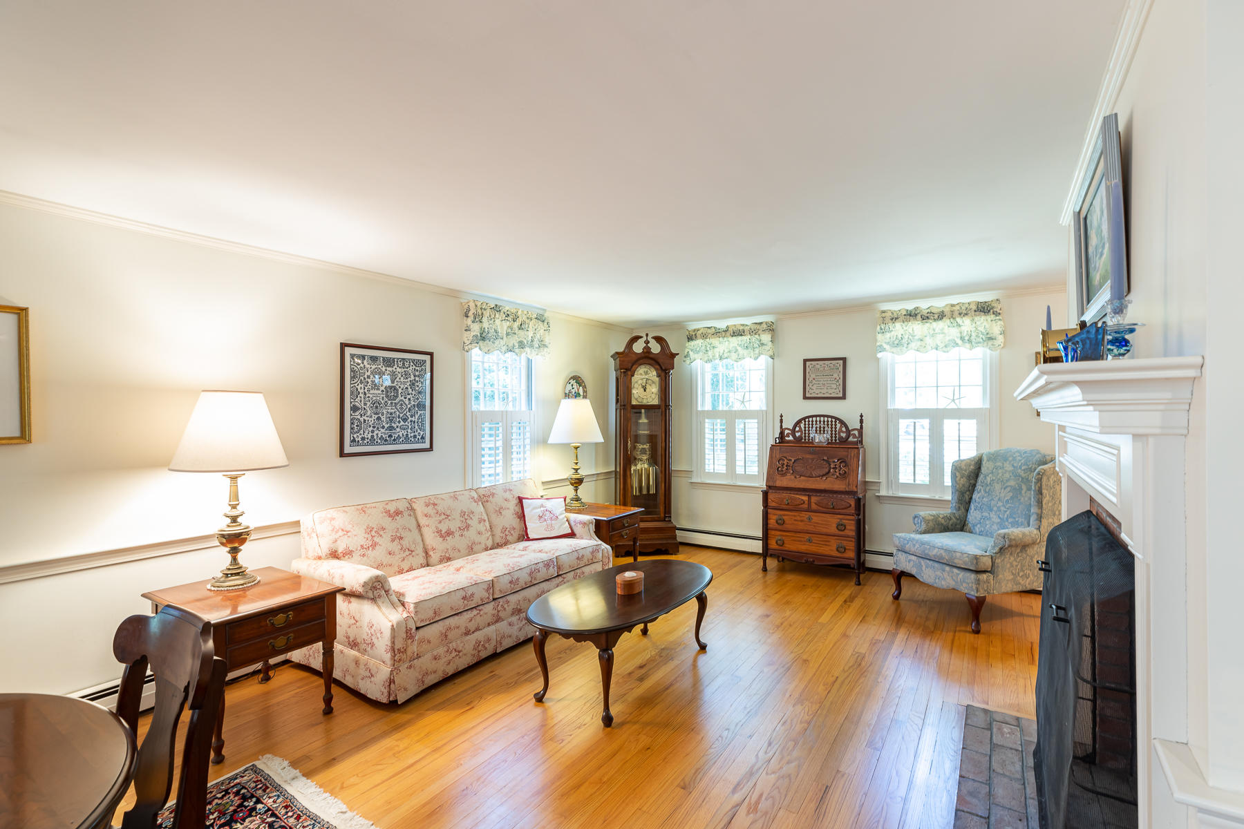 230 Santuit Road Cotuit, MA 02635 - Photo 3 of 46 a living room with furniture and a fireplace