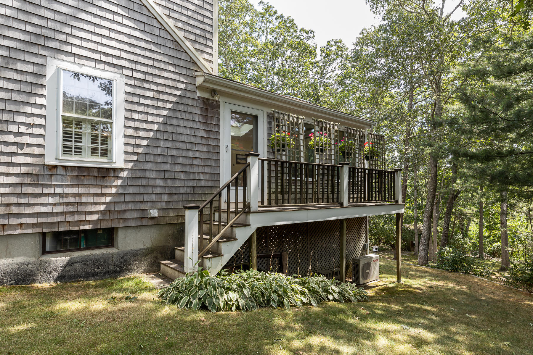 230 Santuit Road Cotuit, MA 02635 - Photo 32 of 46 a front view of a house with a yard