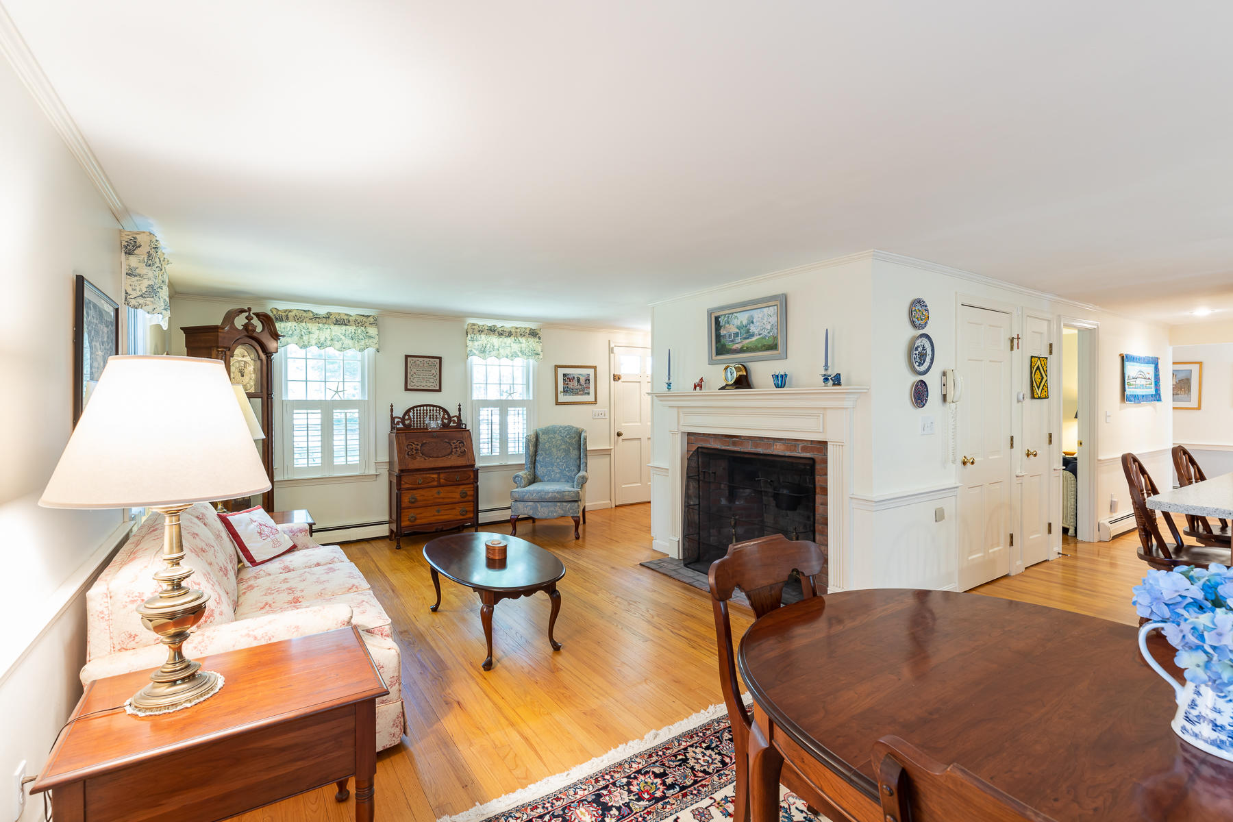 230 Santuit Road Cotuit, MA 02635 - Photo 4 of 46 a living room with furniture a fireplace and a flat screen tv