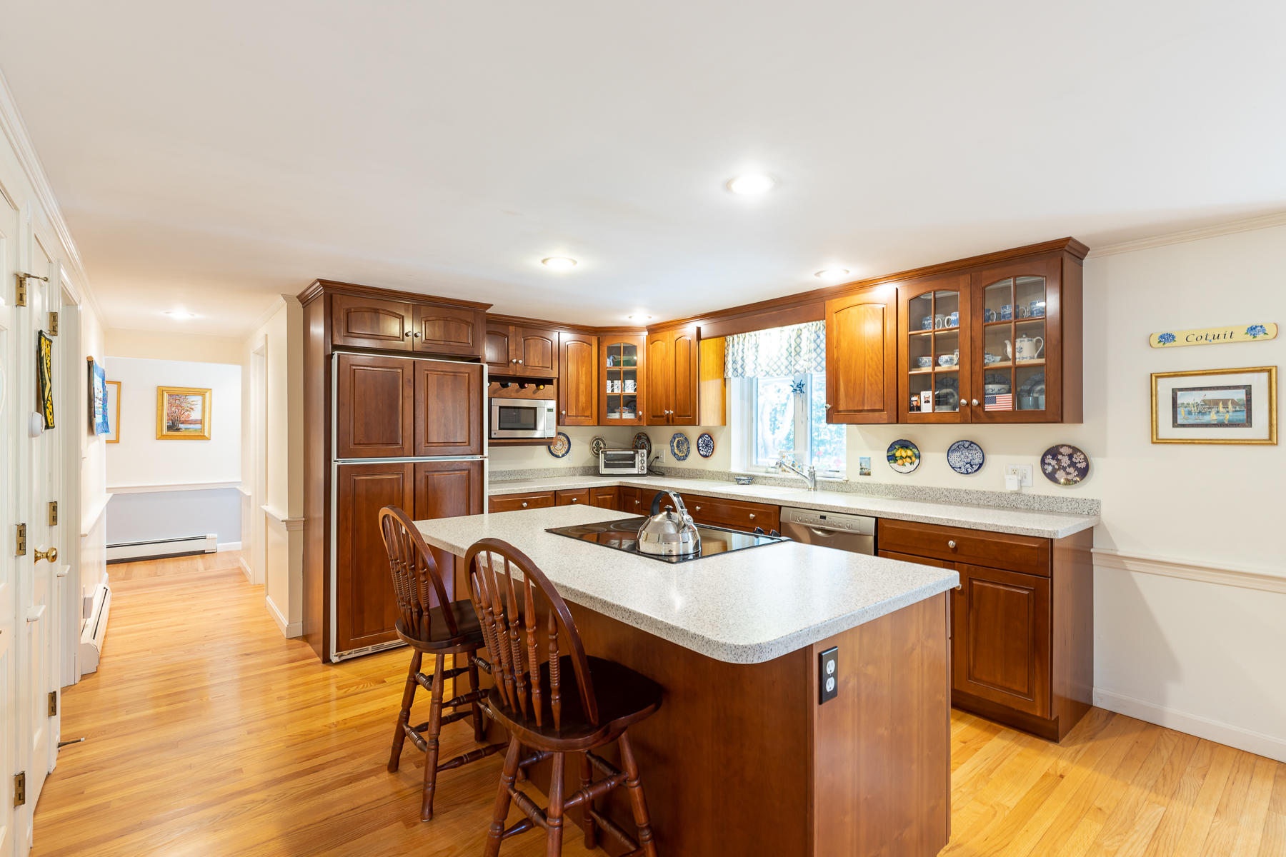 230 Santuit Road Cotuit, MA 02635 - Photo 8 of 46 a kitchen with a sink a counter top space and stainless steel appliances