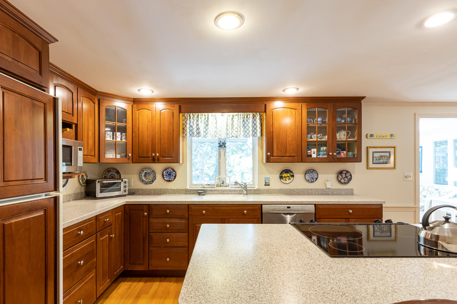 230 Santuit Road Cotuit, MA 02635 - Photo 9 of 46 a kitchen with stainless steel appliances a sink a stove and a refrigerator