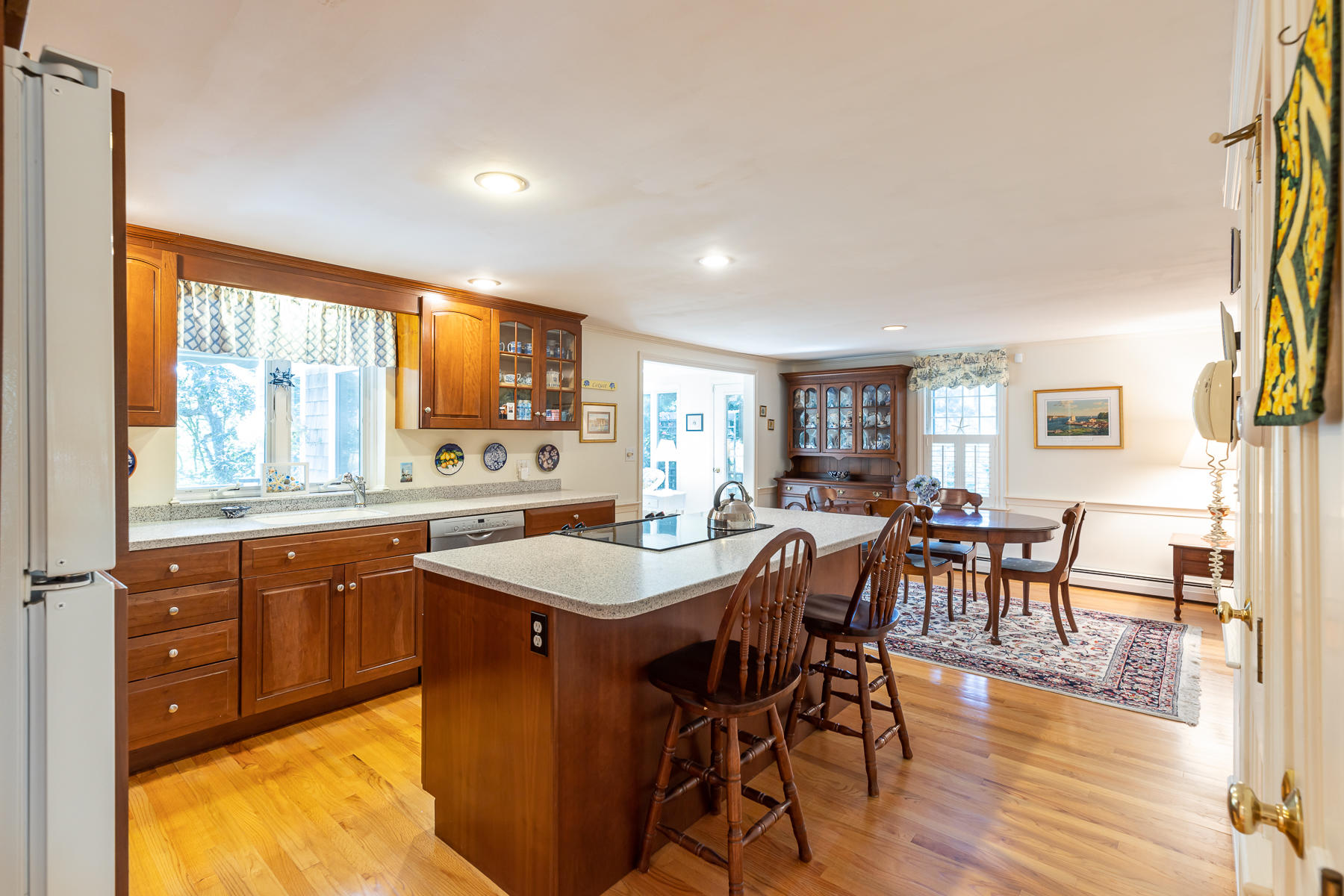 230 Santuit Road Cotuit, MA 02635 - Photo 10 of 46 a view of a dining room with furniture window and wooden floor