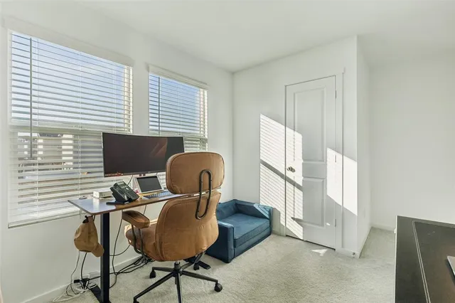 a work room with furniture and a window