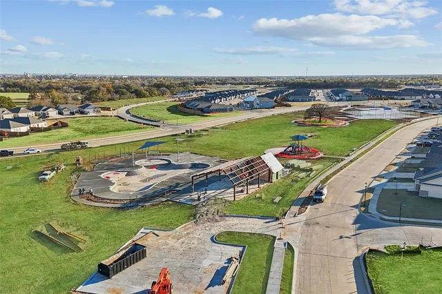 an aerial view of a house with outdoor space