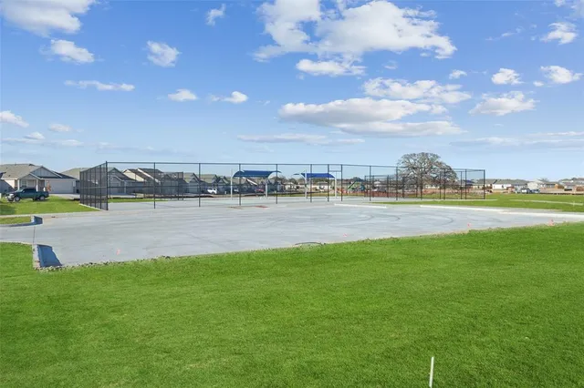 a view of a lake with houses in the back