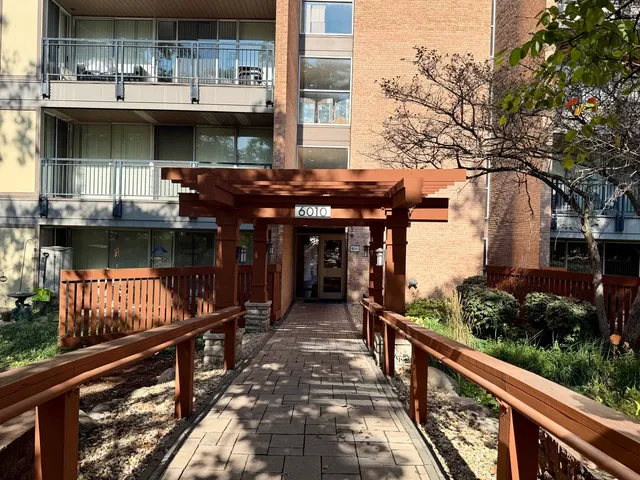 a view of a house with street from a balcony