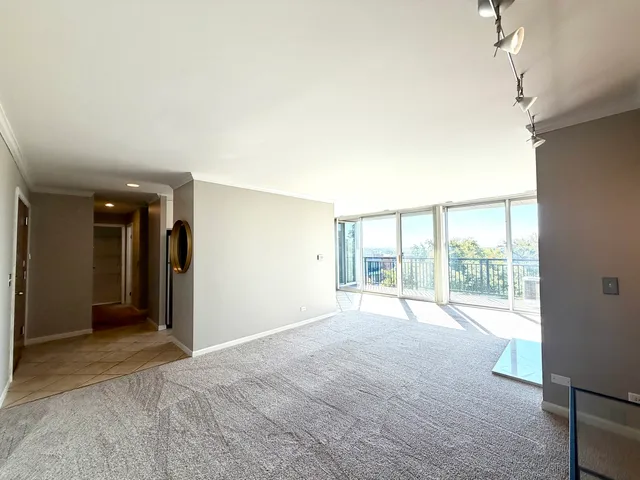 a view of an empty room with a window