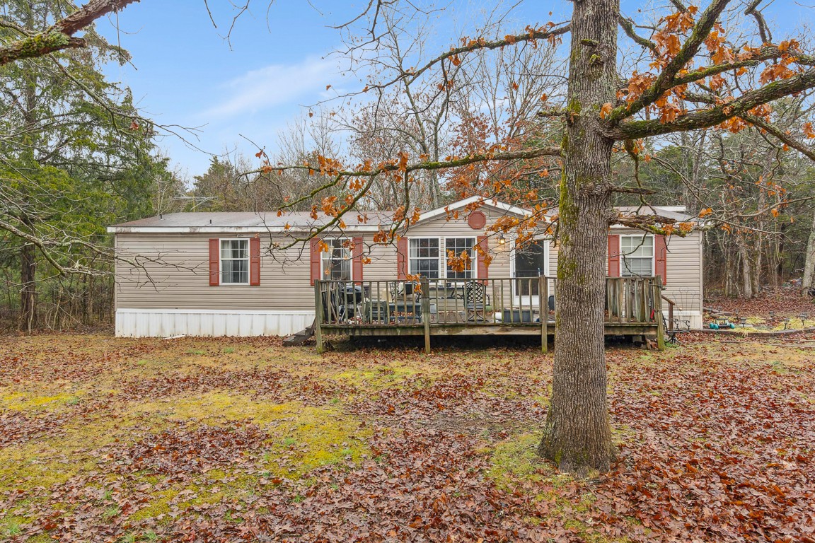 2215 Gwynn Road Lebanon, TN 37090 - Photo 1 of 17 a backyard of a house with large trees and outdoor seating