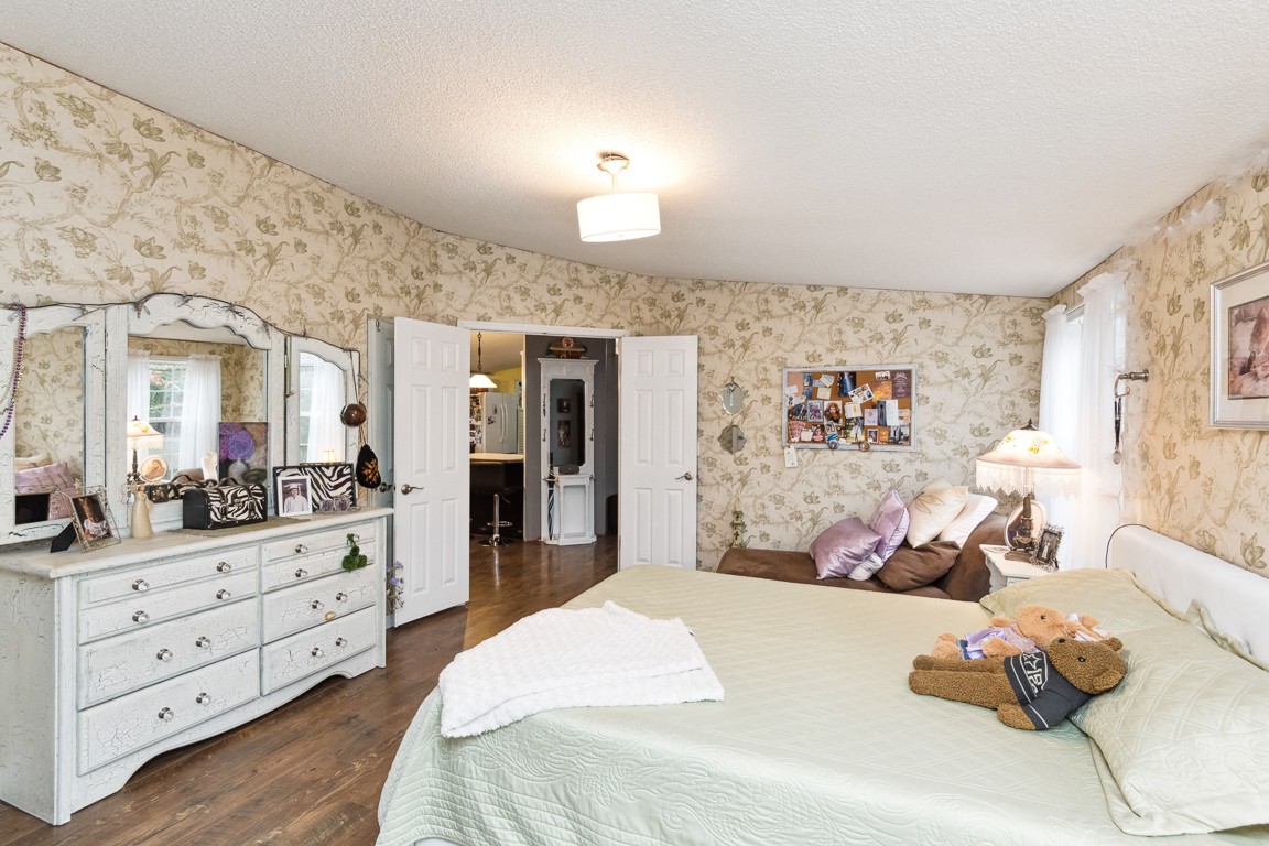 2215 Gwynn Road Lebanon, TN 37090 - Photo 11 of 17 a bedroom with a bed and wooden floor