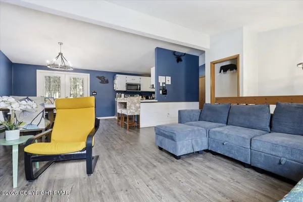 a view of a house with a wooden fence