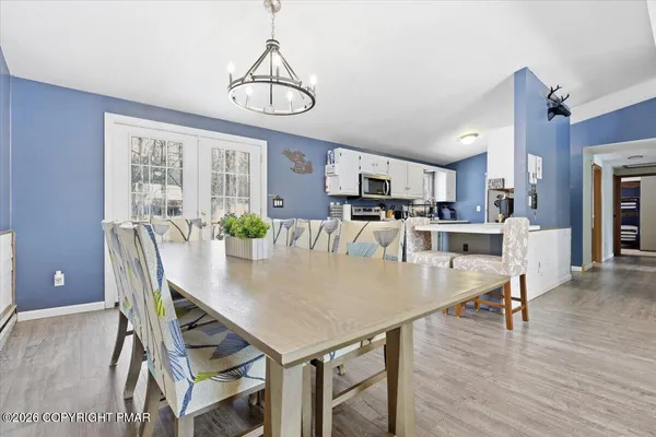 a view of a house with snow on the road