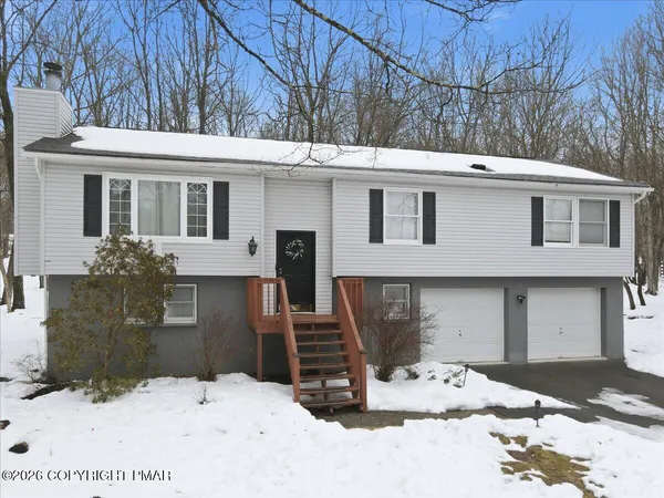 a bathroom with a sink a mirror and a toilet