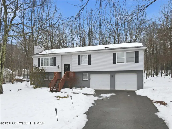 a white toilet sitting next to a shower curtain