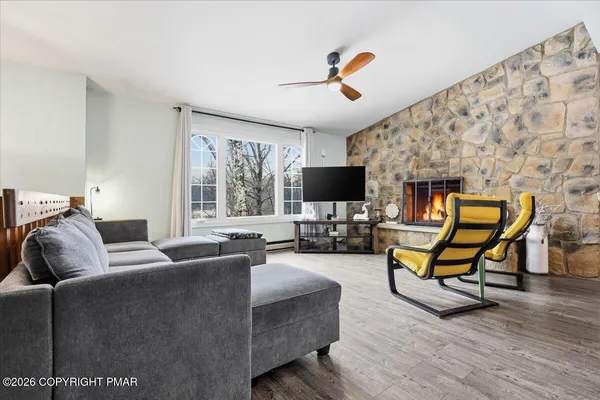 a living room with furniture and a window