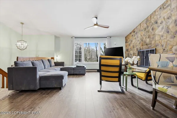 a room with furniture and a flat screen tv