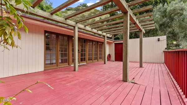 a view of a swimming pool with an outdoor space and seating area