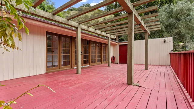 a view of a swimming pool with an outdoor space and seating area