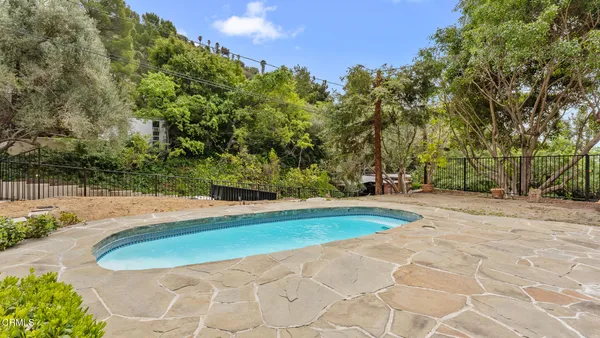 a view of swimming pool with a yard