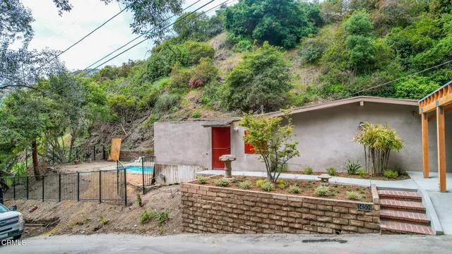 an aerial view of a house with outdoor space and street view