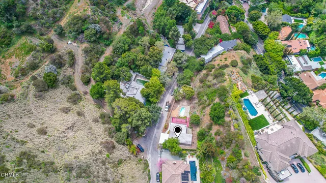 an aerial view of a house with a yard