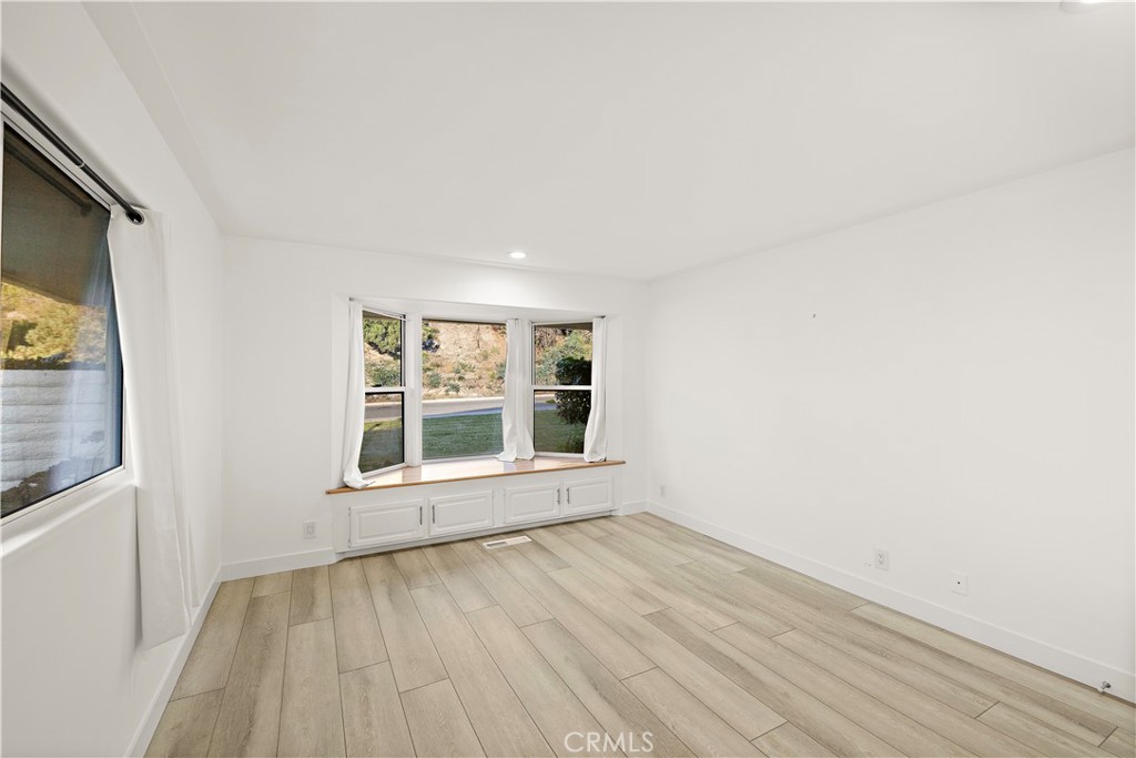 32461 Mediterranean Drive Dana Point, CA 92629 - Photo 13 of 19 an empty room with wooden floor and windows