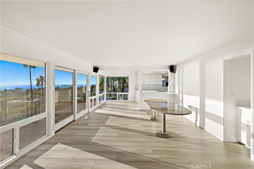 32461 Mediterranean Drive Dana Point, CA 92629 - Photo 5 of 19 a view of staircase with white walls and glass windows
