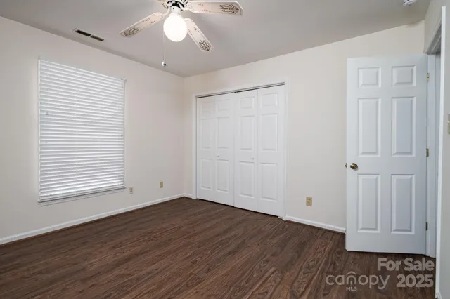 a bathroom with a sink a toilet and vanity