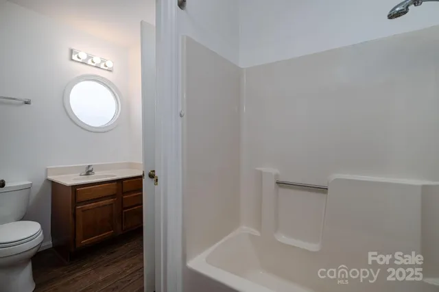 a bathroom with a bathtub and shower