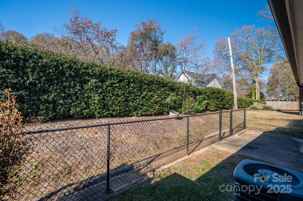 a view of a balcony with wooden fence