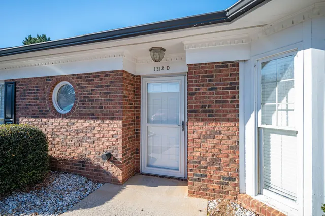 a kitchen with stainless steel appliances granite countertop a refrigerator microwave and sink
