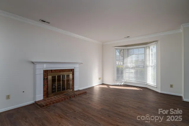 a view of a kitchen with a sink and dishwasher wooden floor