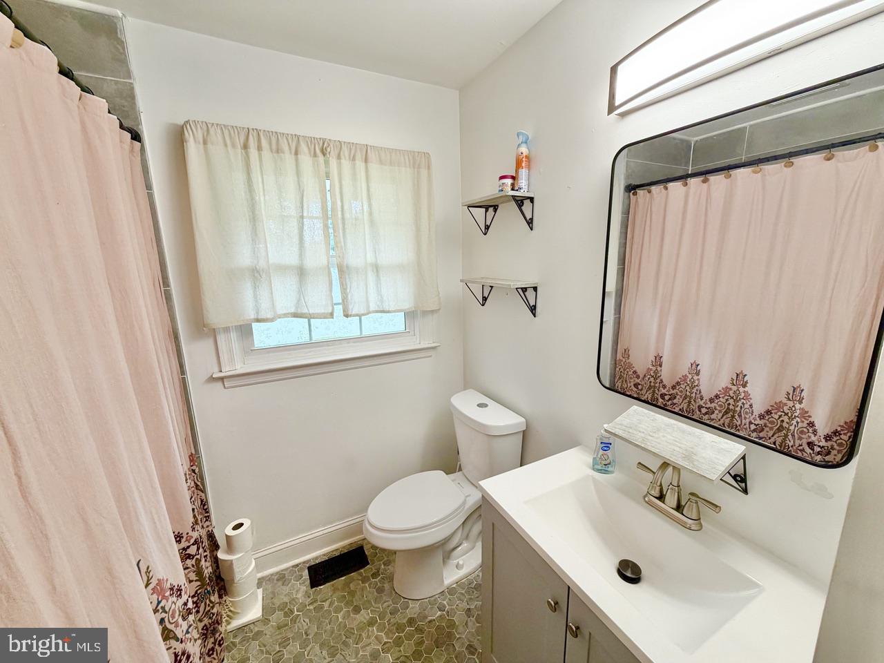 2413 Shelburn Road Millville, NJ 08332 - Photo 23 of 41 a bathroom with a sink toilet and shower