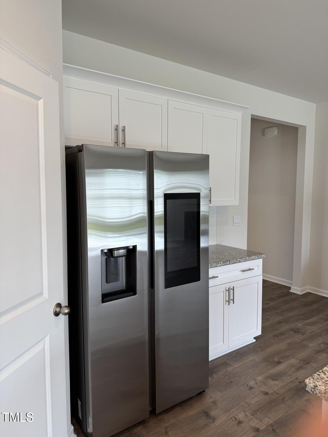 2018 Fletchers Ridge Drive Durham, NC 27703 - Photo 13 of 41 a kitchen with white cabinets and white appliances