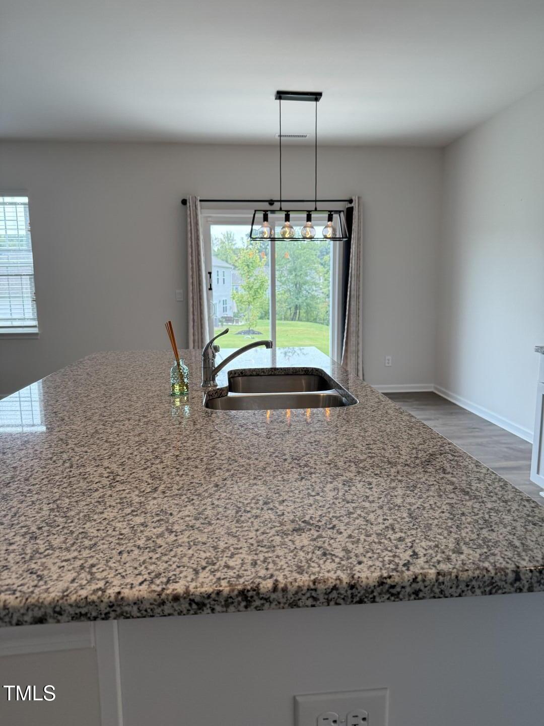 2018 Fletchers Ridge Drive Durham, NC 27703 - Photo 14 of 41 a view of a livingroom with a ceiling fan and entryway