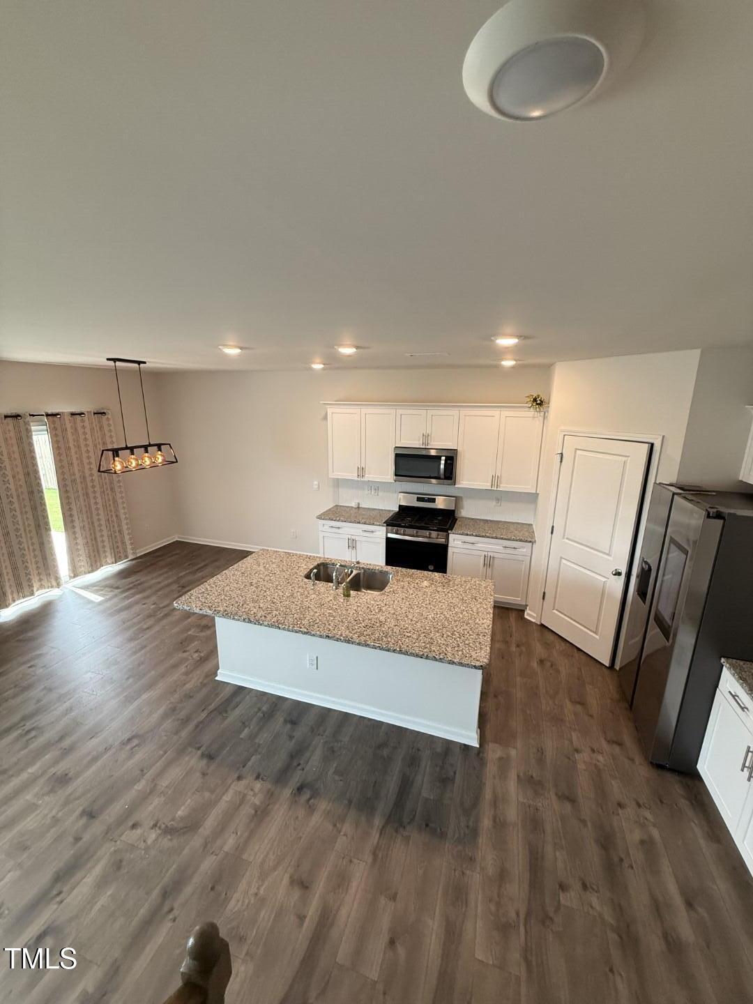 2018 Fletchers Ridge Drive Durham, NC 27703 - Photo 22 of 41 a large white room with wooden floor