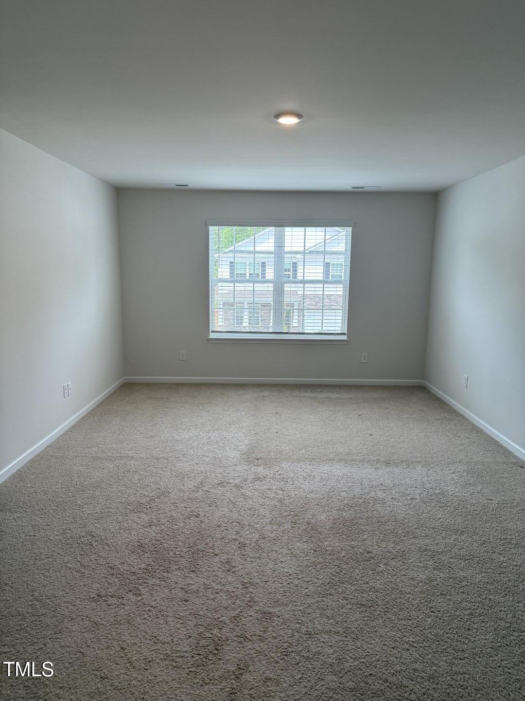 2018 Fletchers Ridge Drive Durham, NC 27703 - Photo 23 of 41 an empty room with a window