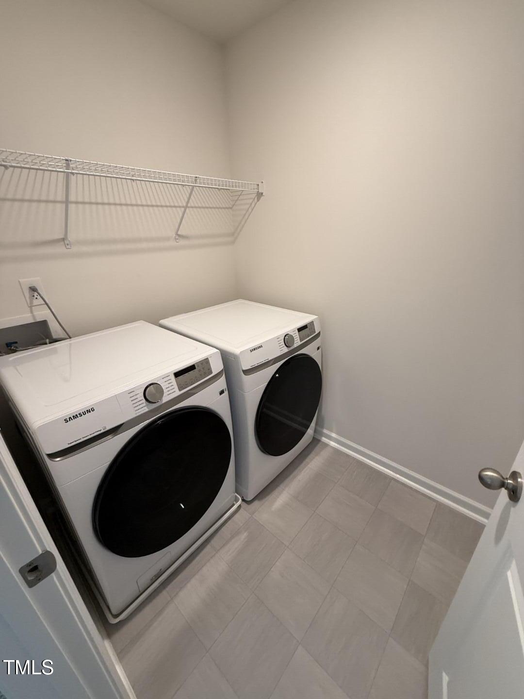 2018 Fletchers Ridge Drive Durham, NC 27703 - Photo 29 of 41 a utility room with dryer and washer