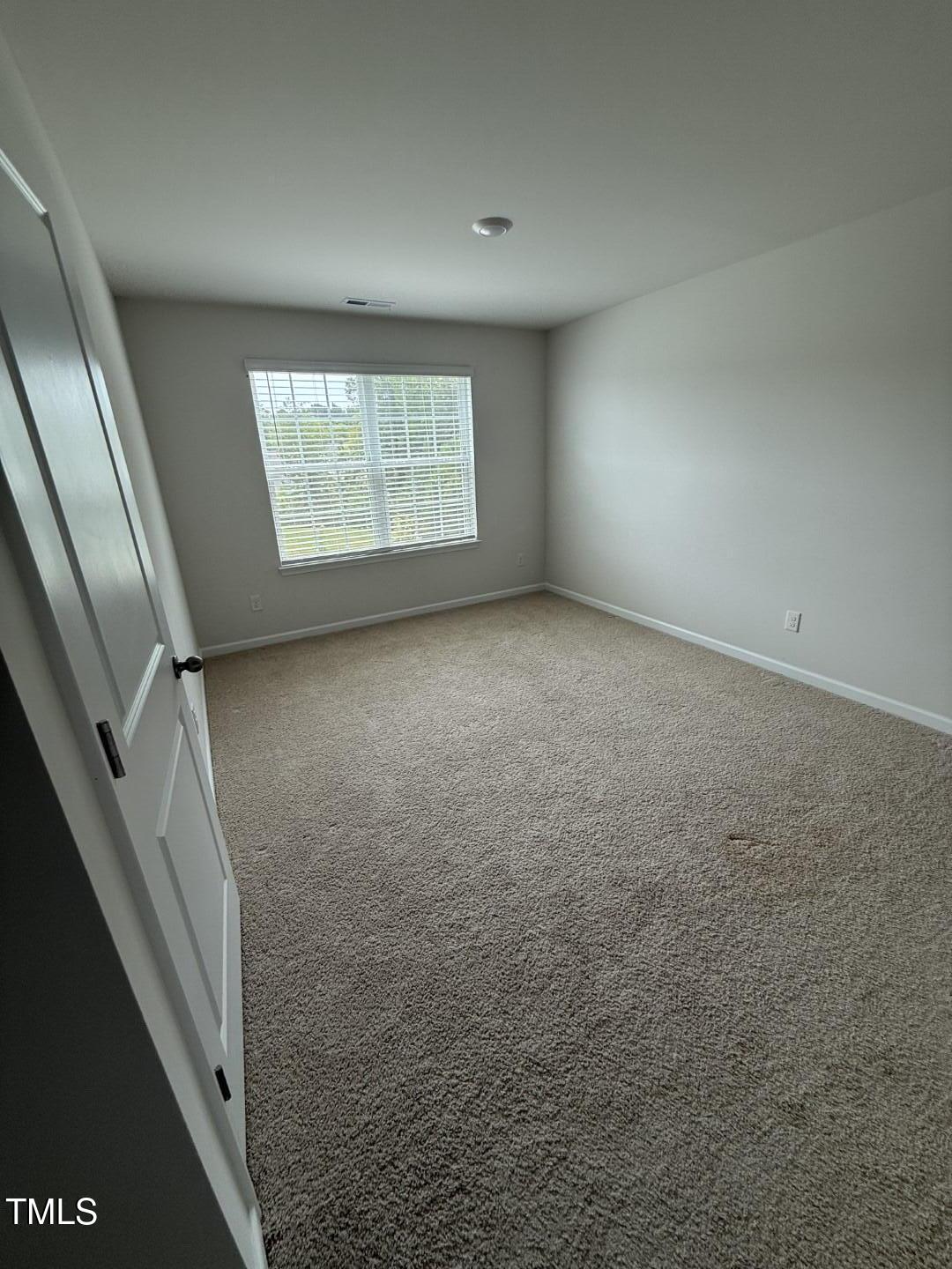 2018 Fletchers Ridge Drive Durham, NC 27703 - Photo 31 of 41 a view of an empty room and a window