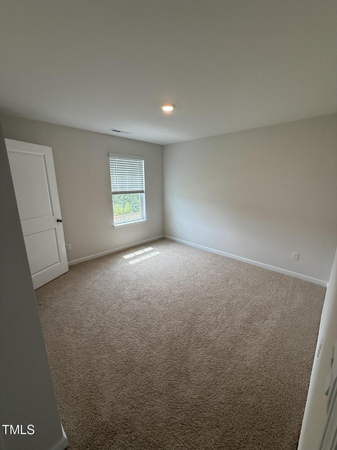 2018 Fletchers Ridge Drive Durham, NC 27703 - Photo 32 of 41 an empty room with windows