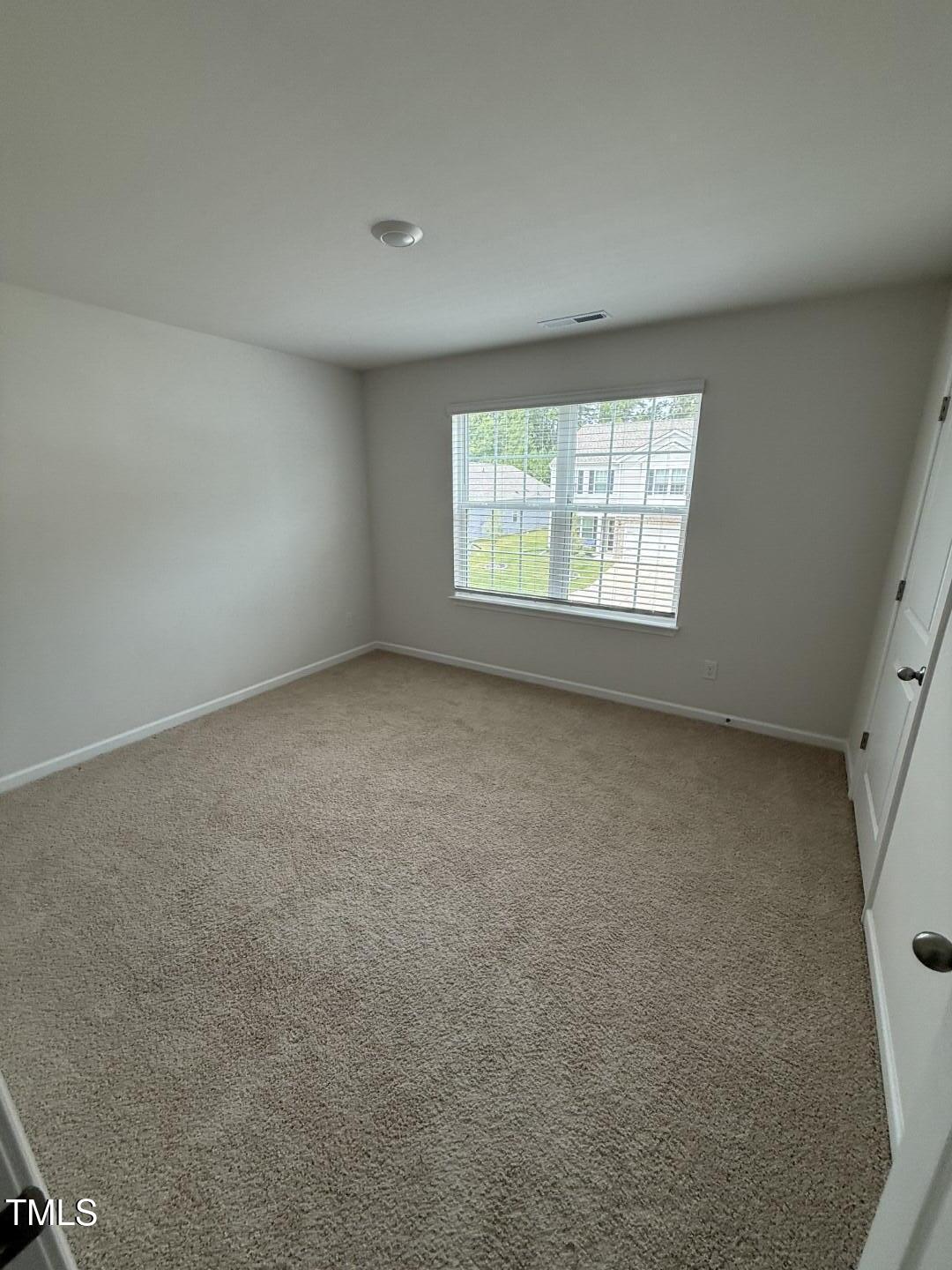 2018 Fletchers Ridge Drive Durham, NC 27703 - Photo 34 of 41 an empty room with a window