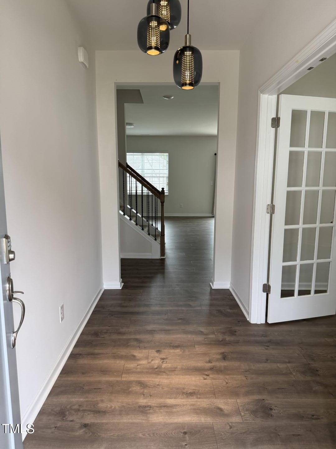 2018 Fletchers Ridge Drive Durham, NC 27703 - Photo 5 of 41 a view of entryway and hall with wooden floor