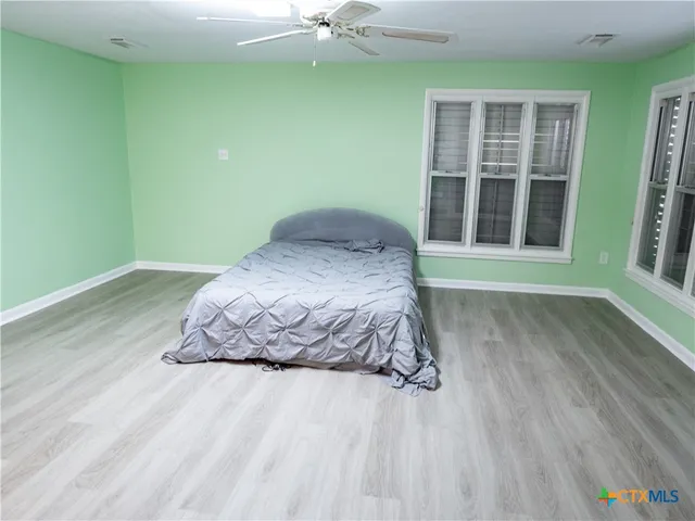 a room with a bed and a window