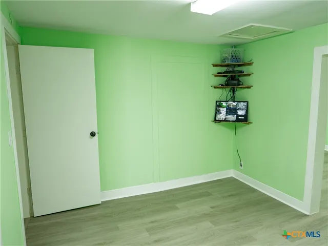 a view of small space with wooden floor