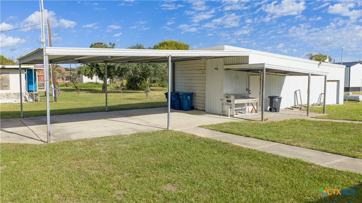 312 Jefferson Avenue Port O'Connor, TX 77982 - Photo 4 of 22 a view of a house with backyard and porch