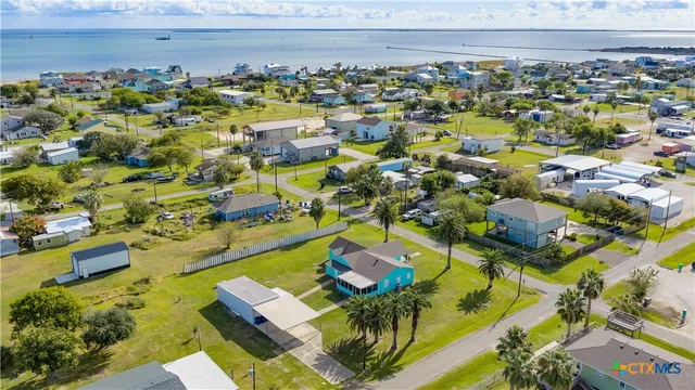 a view of a swimming pool with outdoor seating