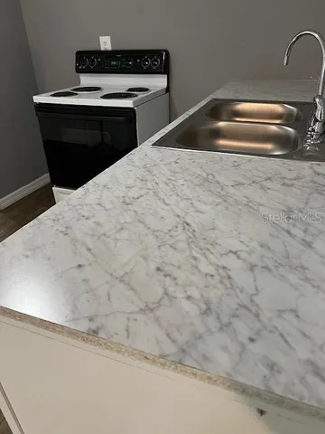 a kitchen with a sink and cabinets