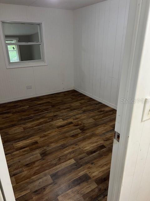 1537 Poe Road Lake Wales, FL 33898 - Photo 13 of 16 a view of an empty room with wooden floor and a window