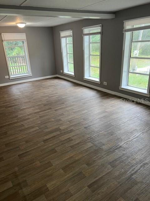 1537 Poe Road Lake Wales, FL 33898 - Photo 8 of 16 a view of an empty room with wooden floor and a window