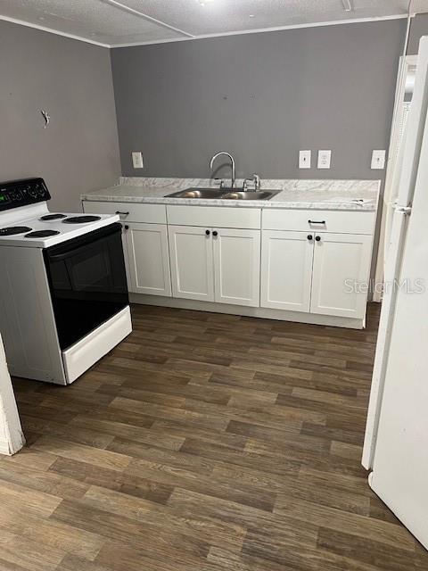 1537 Poe Road Lake Wales, FL 33898 - Photo 9 of 16 a view of a kitchen with cabinets and wooden floor